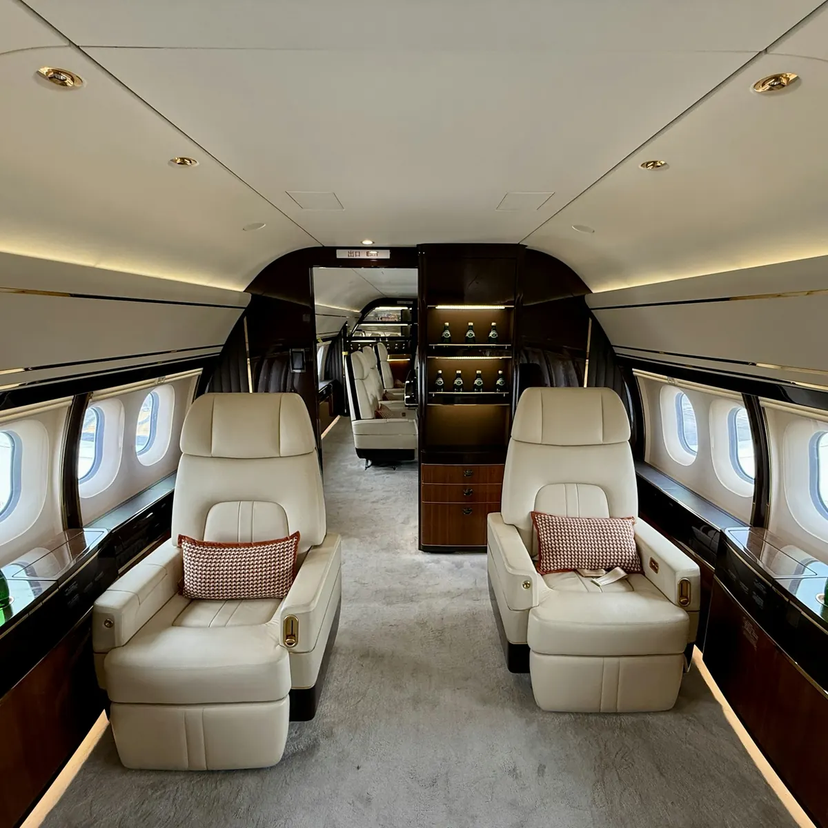 Spacious private jet cabin with club seats