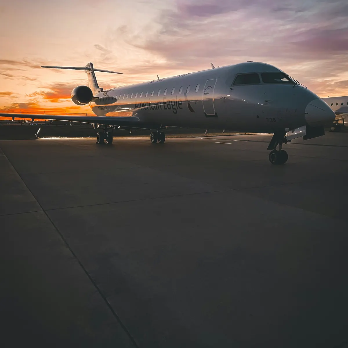 Business jet parked on the ramp at dusk