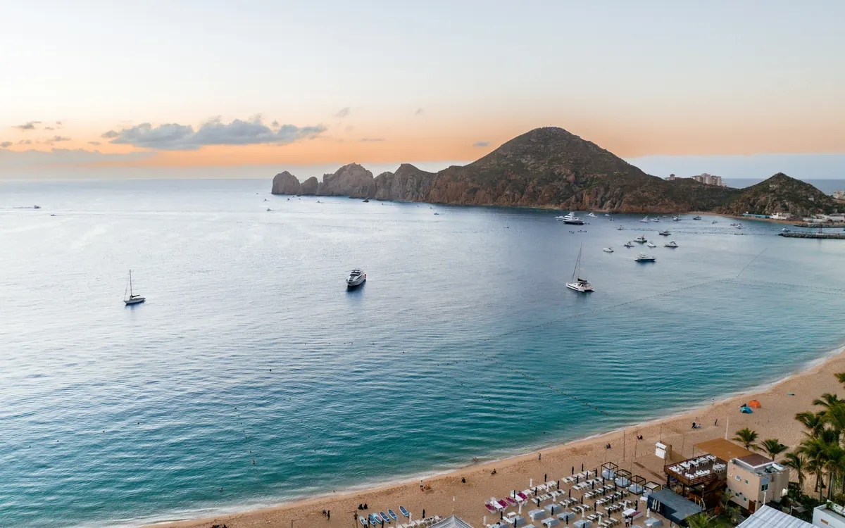 Curving beach and calm bay at Cabo San Lucas